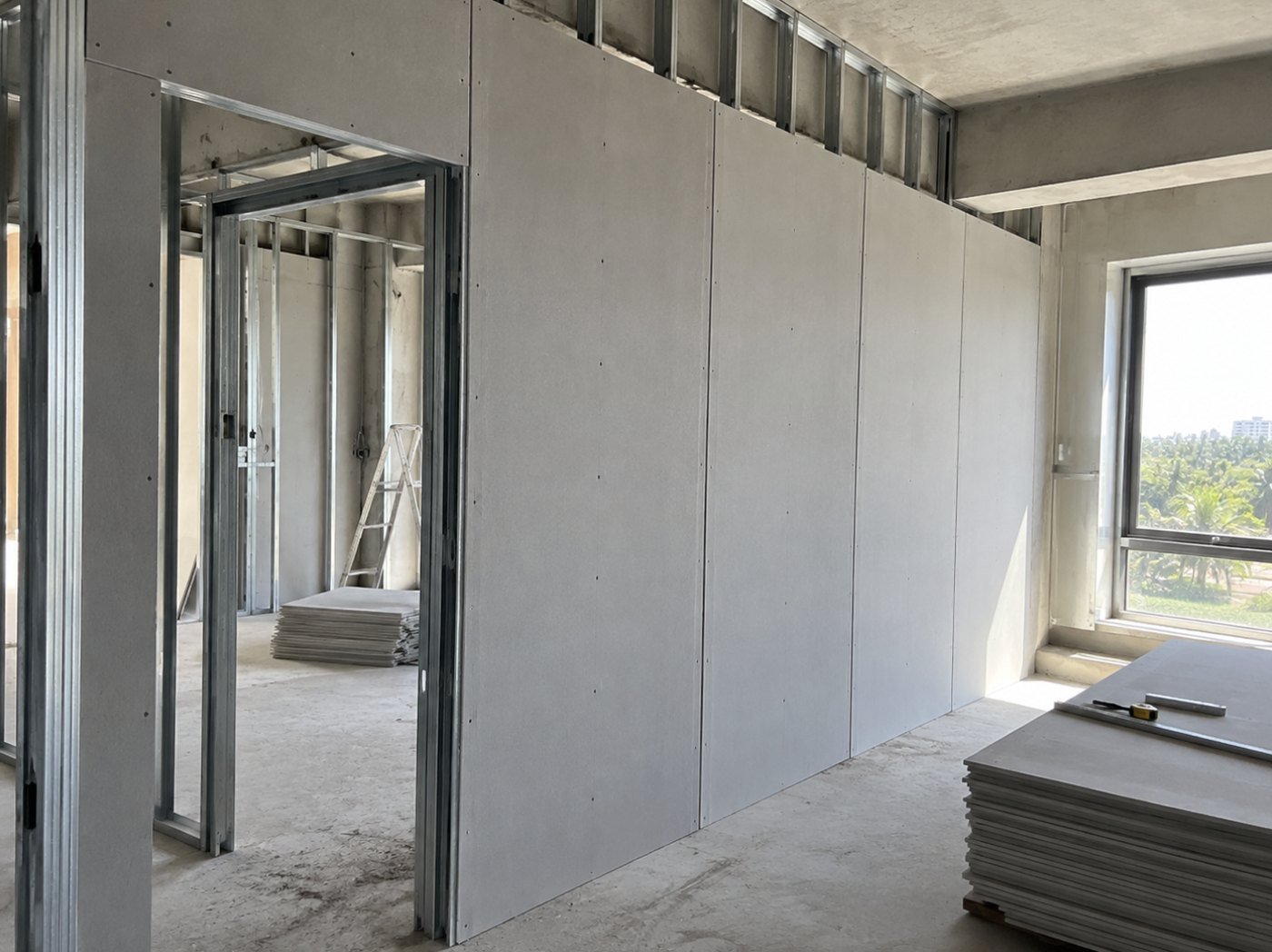 Fibre cement board sheathing fixed to light gauge steel framing for an LGSF partition